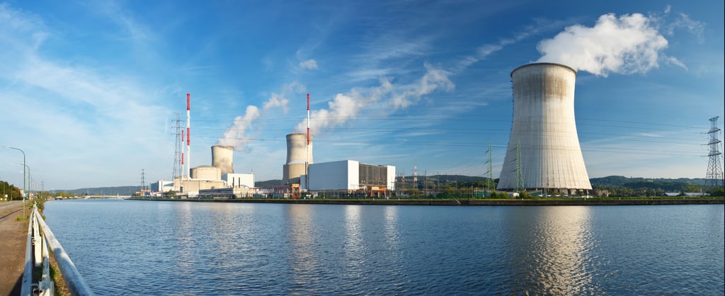 Cooling towers and infrastructure at a nuclear power station beside a river