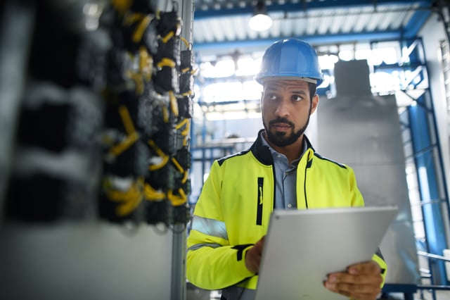 worker reviewing work environment