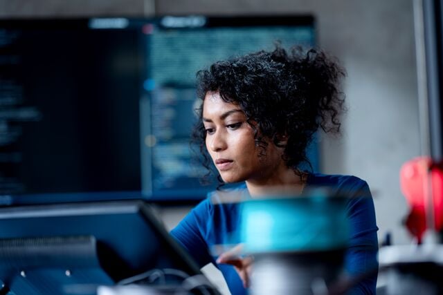 Woman looking at laptop