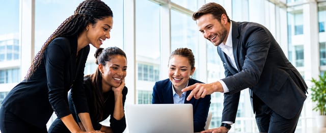 Collaborative team around a laptop