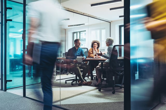 Group of people having a discussion in a meeting room